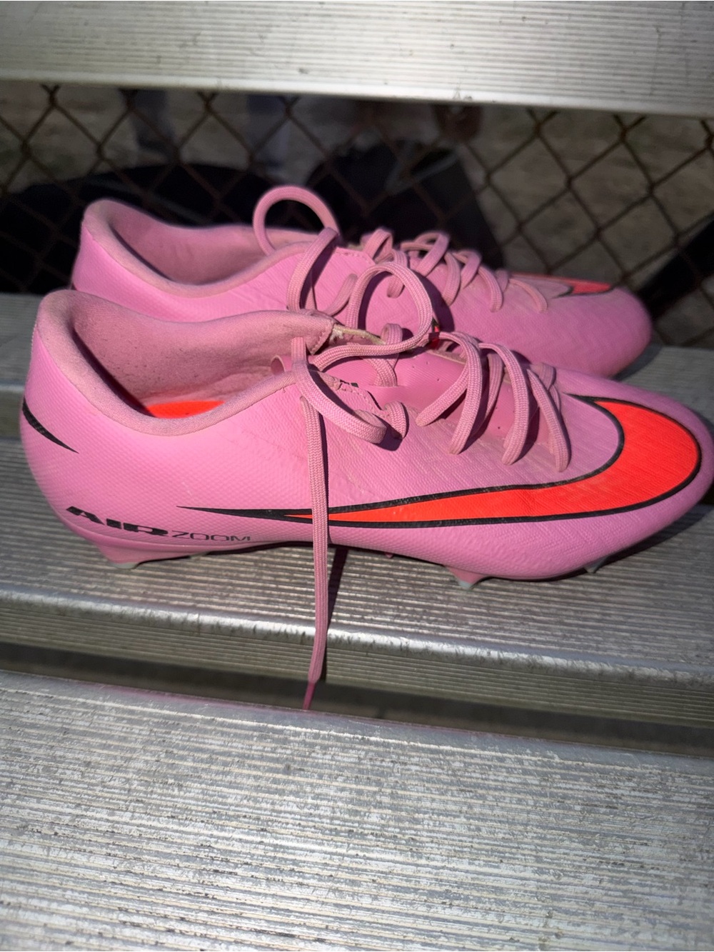 Nike Women’s Pink Soccer Cleats with Orange Swoosh